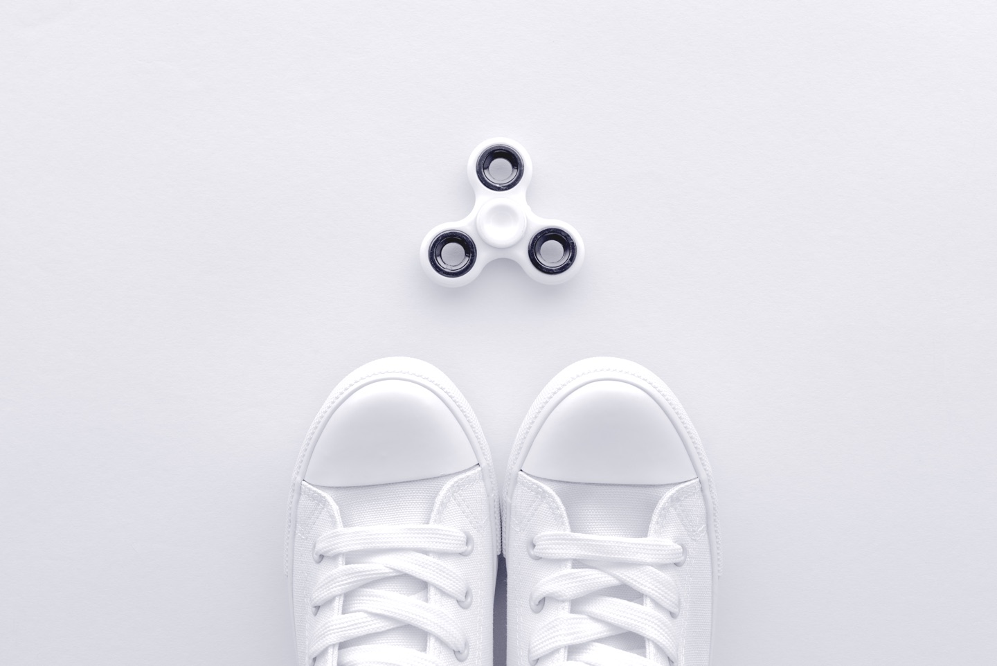 sneakers-and-fidget-spinner-flay-lay-top-view-N9QPTCE